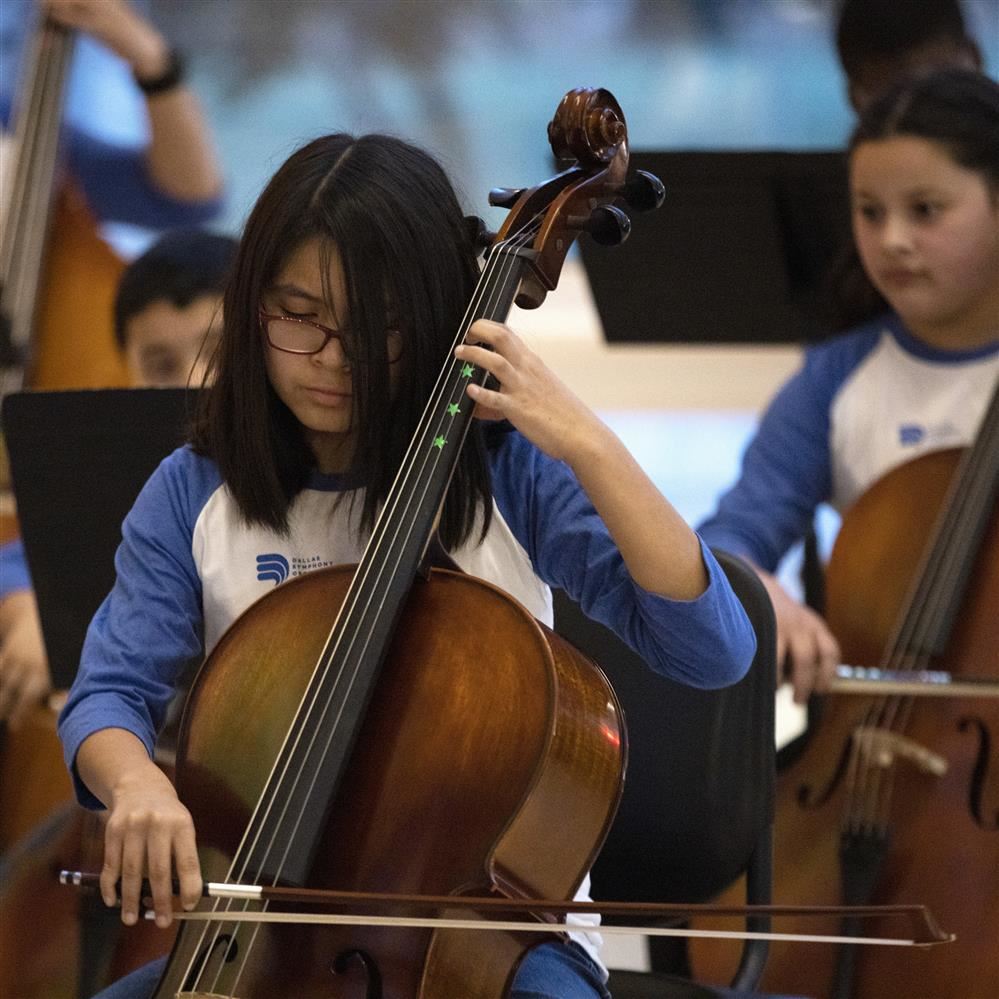  Two students playing string instruments